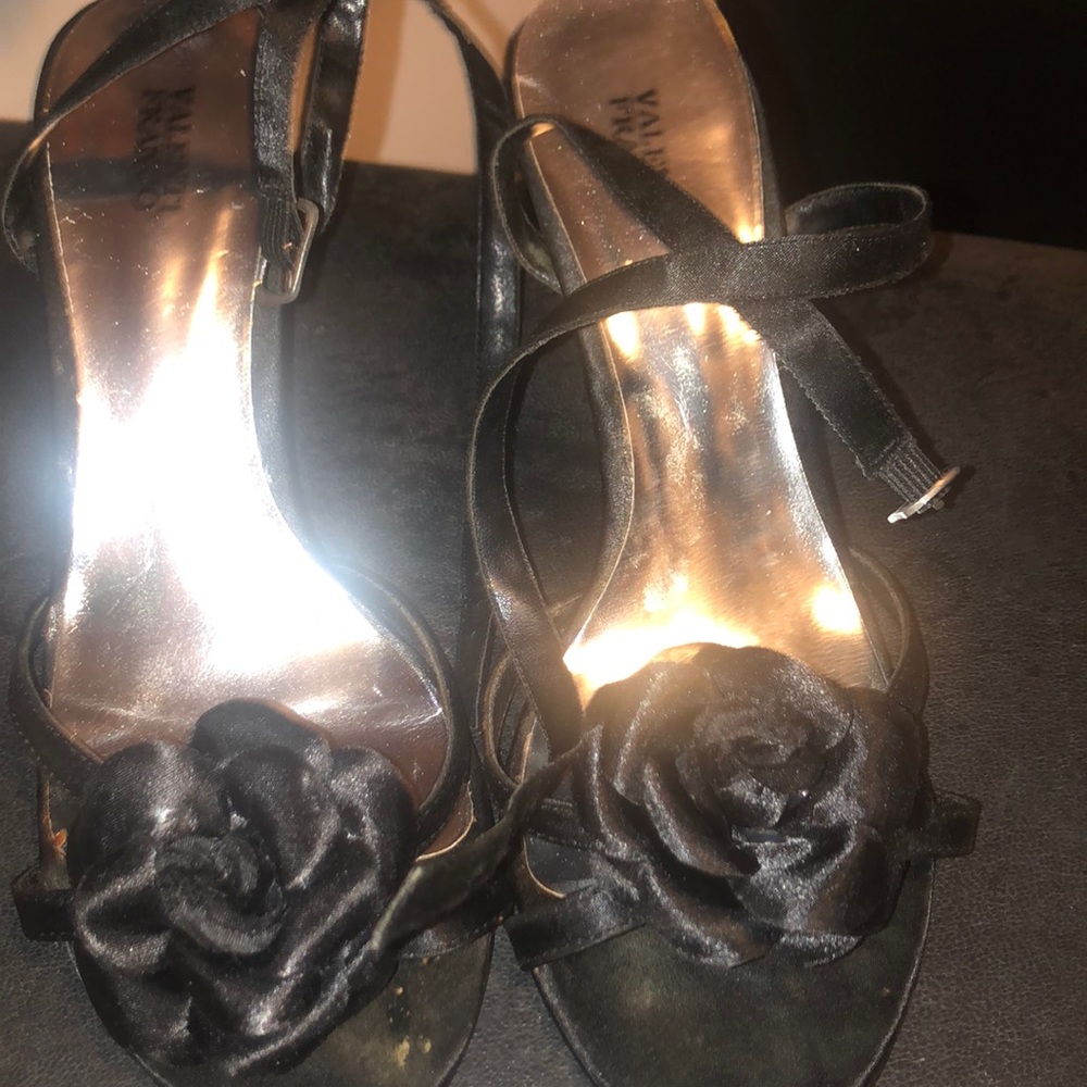 Roughly worn black sandals very  cute though